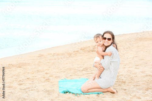 Happy mother with little so...