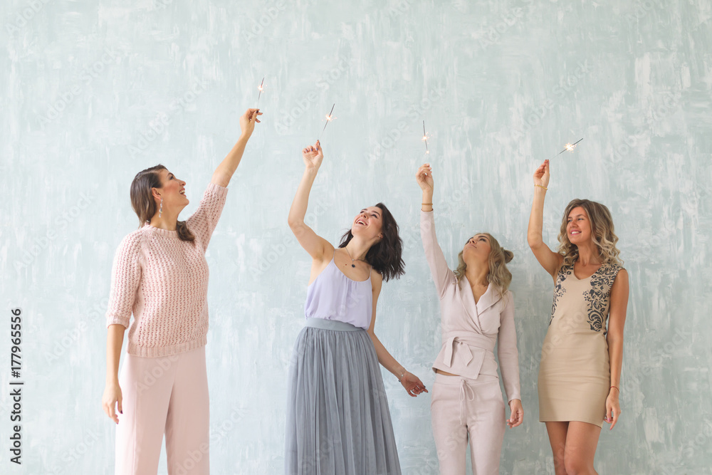 Naklejka premium Women with sparklers, Happy group of friends lighting sparklers