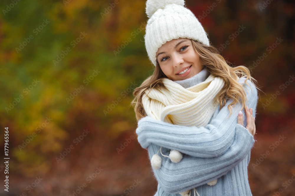 Very beautiful young woman on the autumn background. Close up portrait of smiling young pretty girl in the fall time. Very beautiful young woman on the autumn background. Close up portrait of smiling young pretty girl in the fall time.