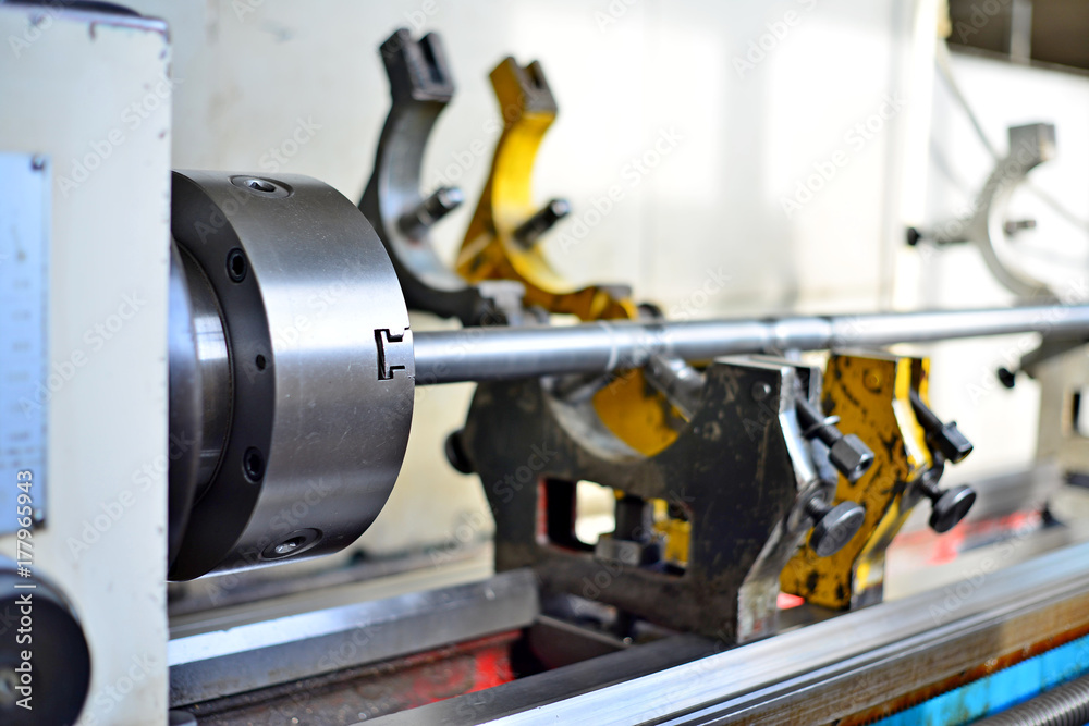 Technicians are turning lathe with horizontal lathe machine. Technicians are turning lathe with horizontal lathe machine.