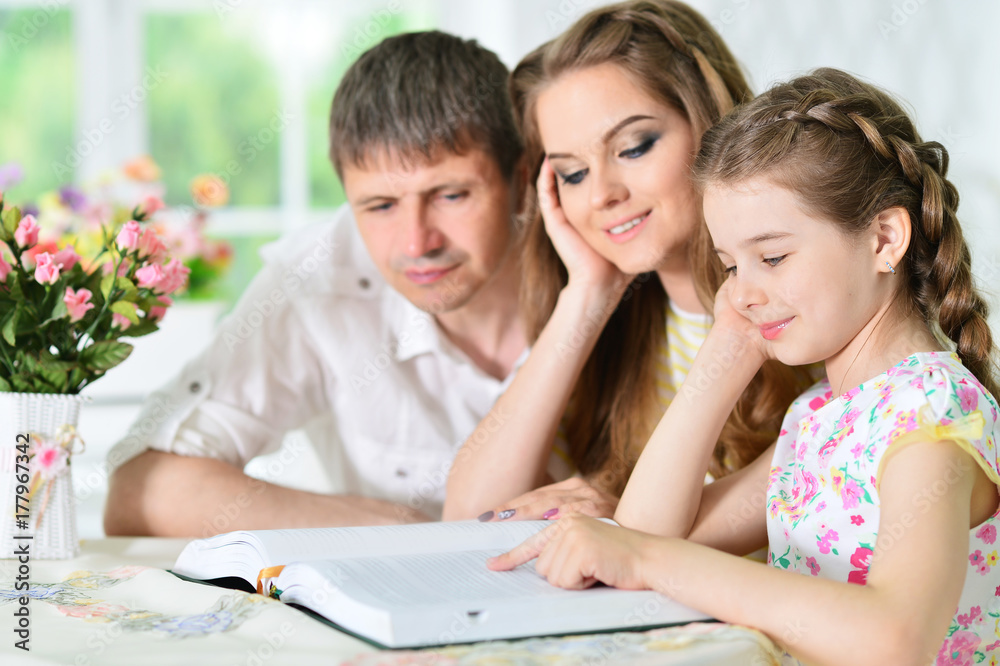 Happy family with book