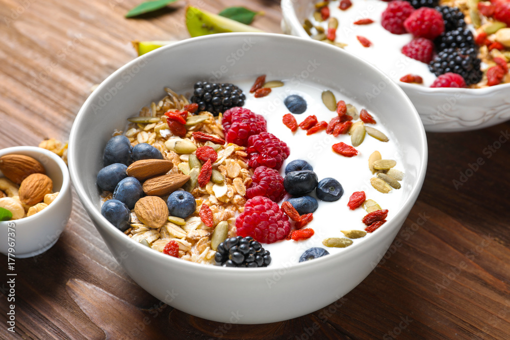 Tasty breakfast with goji berries in bowl on table Tasty breakfast with goji berries in bowl on table