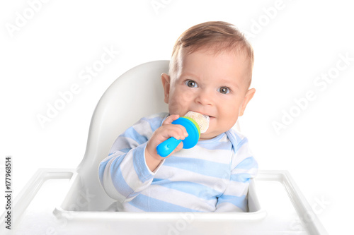 Cute little baby with nibbler on white background photo