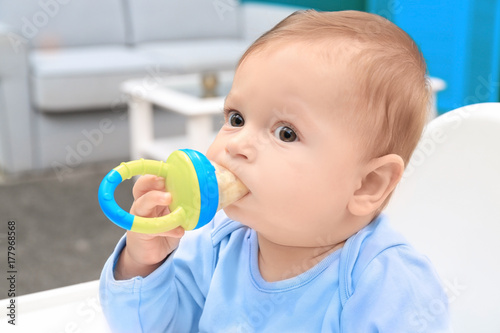 Cute little baby with nibbl...
