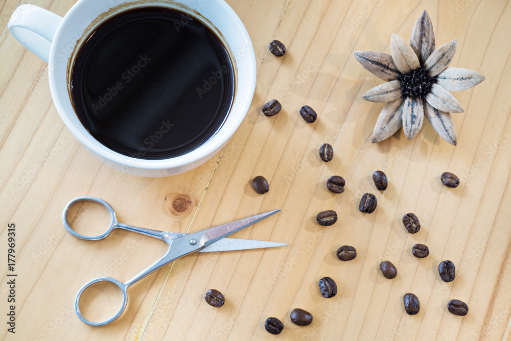 Coffee cup and scissors on a wooden table, selective focus (detailed close-up shot)
Coffee cup and scissors on a wooden table, selective focus (detailed close-up shot)