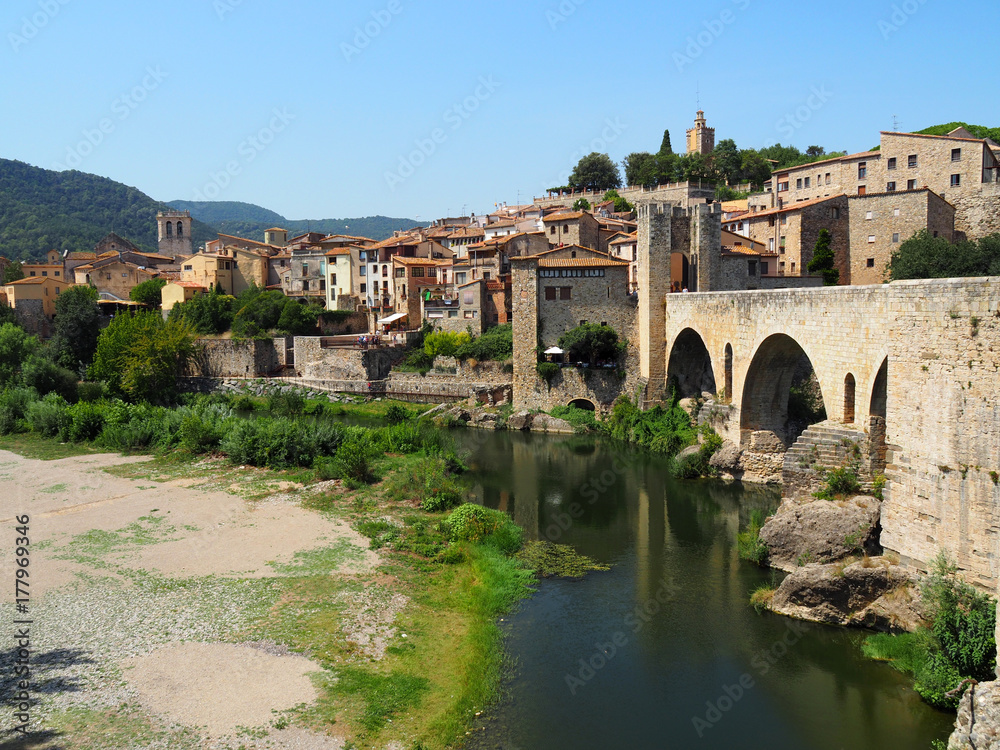 View of the Fluvia river and the medieval village of Besalu in Girona - Spain