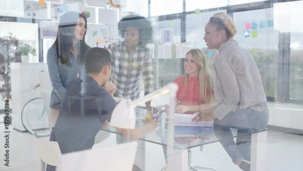 Business team in young startup company discussing profits & sales in a meeting. Shot on RED Epic. Business team in young startup company discussing profits & sales in a meeting. Shot on RED Epic.