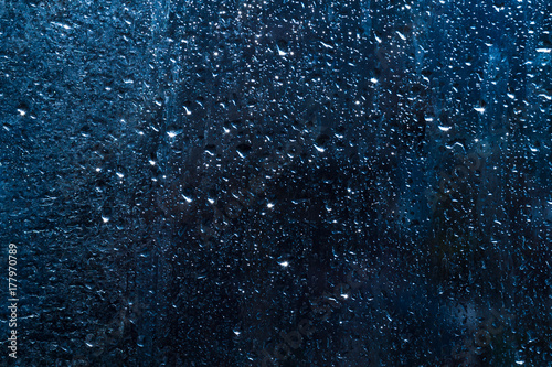 drops on glass , blue background