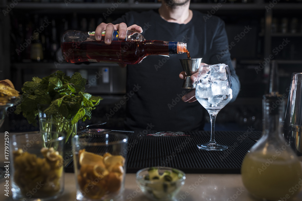 Man working at cocktail bar