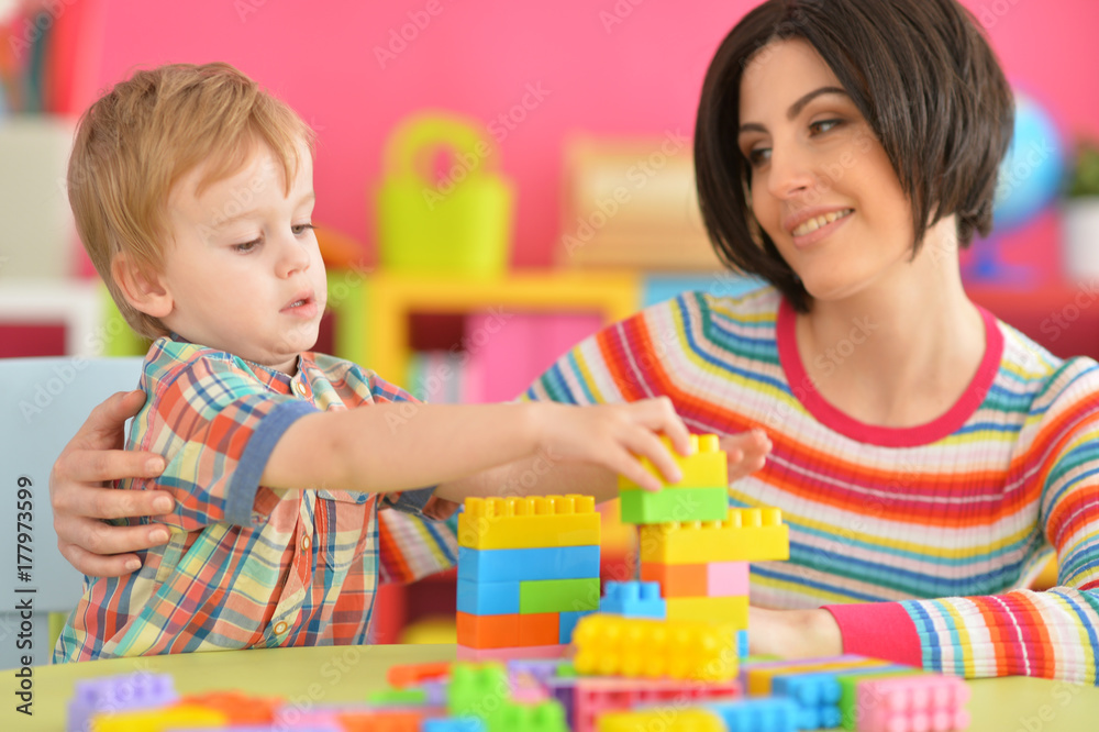 Young mother playing with son Young mother playing with son