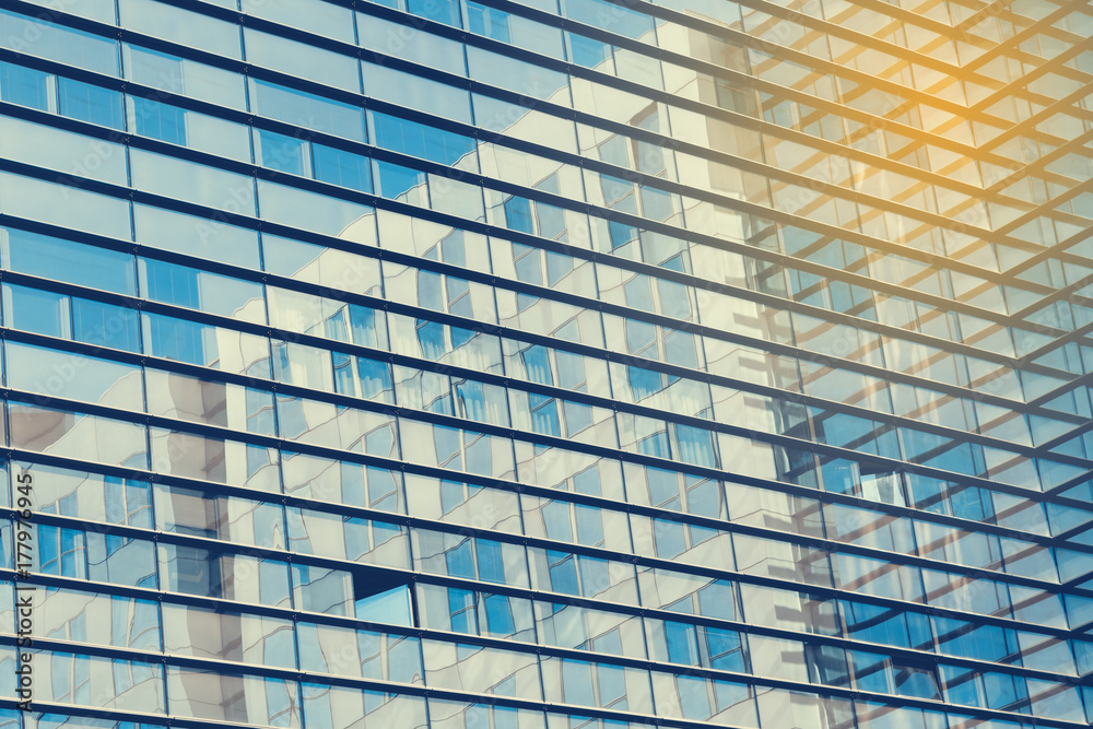 Abstract shot of glass transparent skyscraper office building for texture or background. Blue toned. Abstract shot of glass transparent skyscraper office building for texture or background. Blue toned.