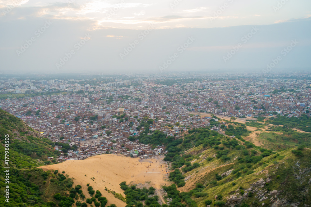 Naklejka premium Jaipur, India - September 20, 2017: Beautiful aerial view of old rooftops of the buildings in the city in Rajasthan state, in India