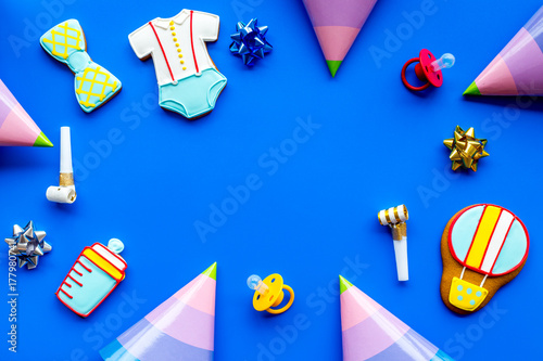 Child birthday celebration with gingerbread cookies on blue colorful background top view space for text
