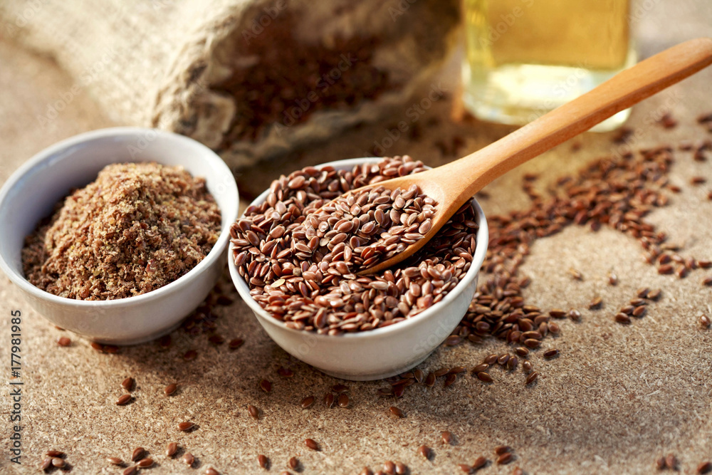 Flax seeds on spoon and in bowl Flax seeds on spoon and in bowl