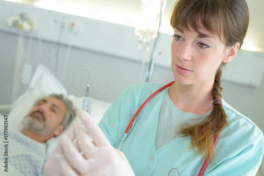 nurse or doctor preparing an injection nurse or doctor preparing an injection