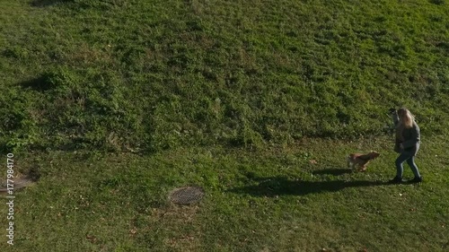 Wallpaper Mural Happy girl with dog plays at grass Torontodigital.ca