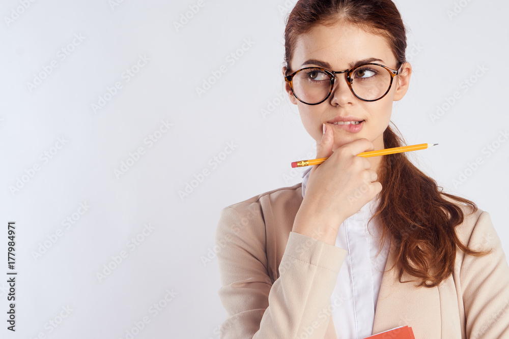 a business woman with a pencil is smart about something that reflects a business woman with a pencil is smart about something that reflects