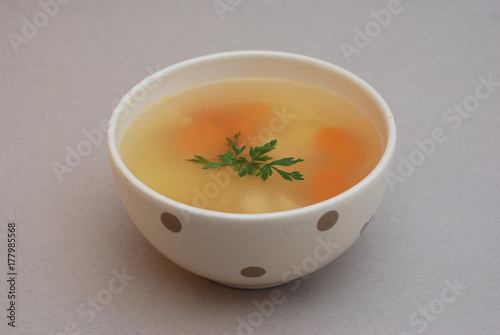 Chicken Soup in bowl isolated on gray background