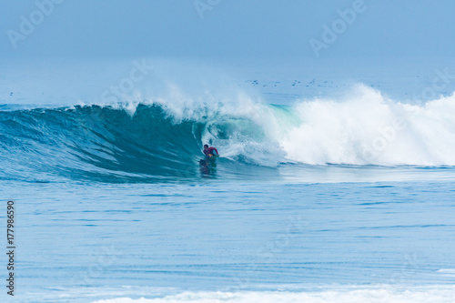 Bodyboarder surfing ocean wave © homydesign