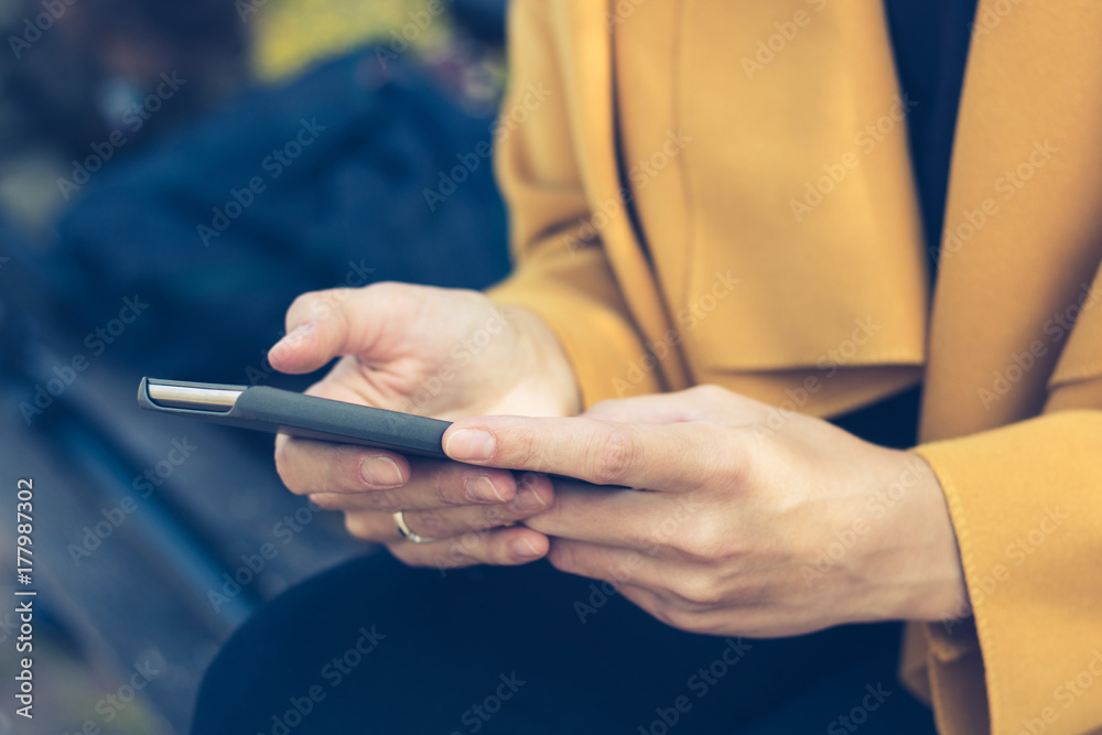 Close up of woman using mobile phone.