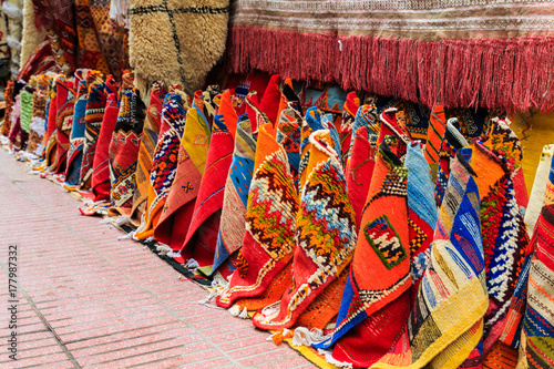 Colorful carpets in a street of marrakesh medina, morocco © pwollinga
