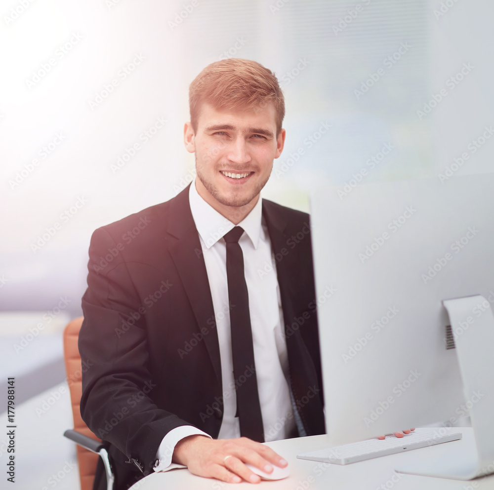 Portrait of happy businessman at the workplace Portrait of happy businessman at the workplace
