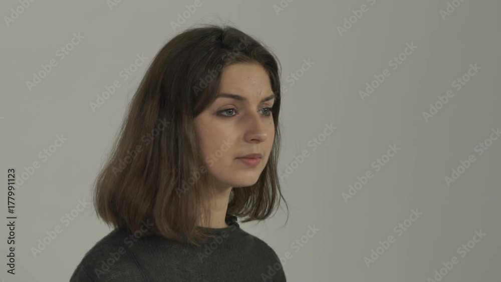 The girl turns around and looks somewhere The girl turns around and looks somewhere
