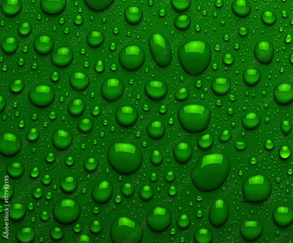 Droplets of liquid on green surface