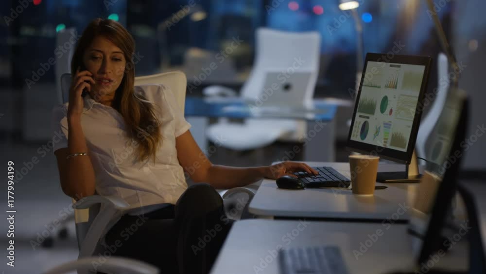Portrait confident businesswoman working late at the office Portrait confident businesswoman working late at the office