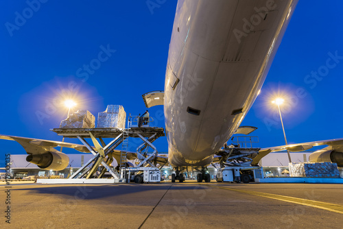 Business of air cargo freighter with import and export at twilight sky