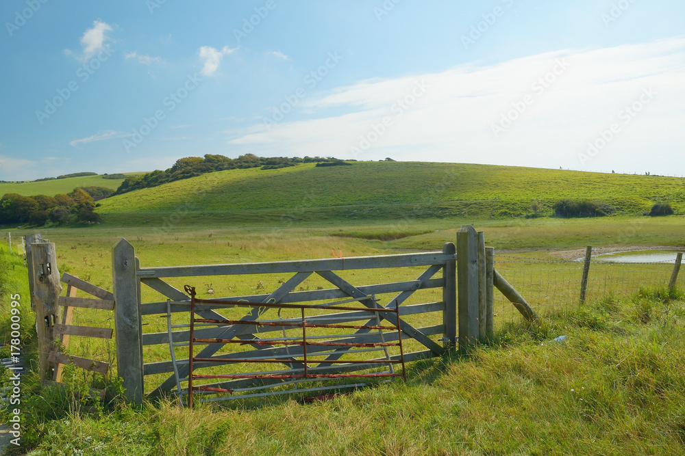 Beautiful meadow with wooden gate on Seven sisters, United Kingdom