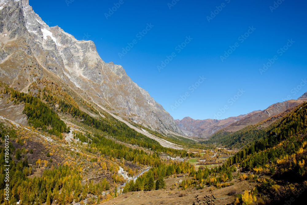 View of mountain peaks, valleys and pine tree forests in Val Ferret, Aosta Valley, Italy View of mountain peaks, valleys and pine tree forests in Val Ferret, Aosta Valley, Italy