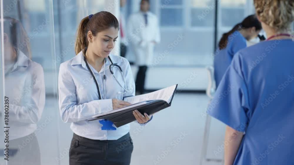  Portrait smiling doctor in modern hospital