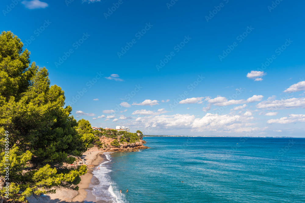 Obraz premium View of the coastline of the Costa Dorada in Miami Platja, Tarragona, Catalunya, Spain. Copy space for text.