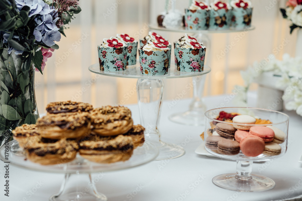 stylish luxury decorated orange candy bar for the celebration of a wedding of happy couple, cathering in the restaurant