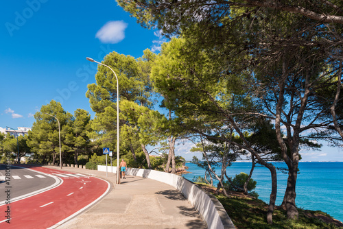 The road along the coast of the Costa Dorada in Miami Platja, Tarragona, Catalunya, Spain. Copy space for text.