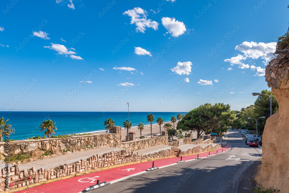 The road along the coast of the Costa Dorada in Miami Platja, Tarragona, Catalunya, Spain. Copy space for text.