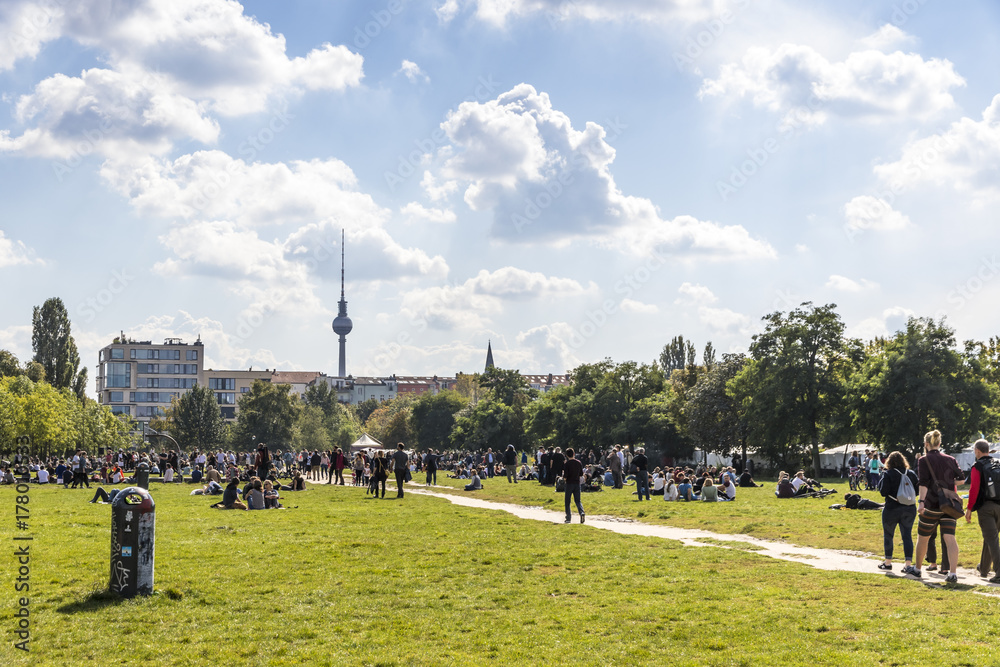 People enjoy sunny Sunday at Mauerpark in Berlin