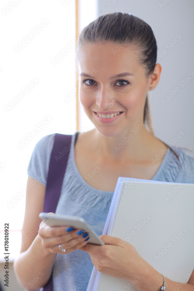 Woman use of mobile phone in university. Student woman