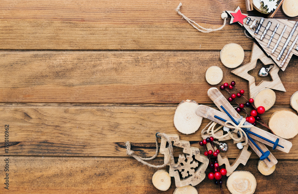 Christmas rustic decorations over wooden background