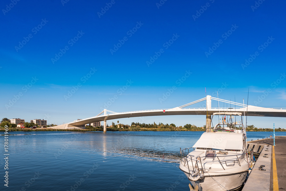 Sant Jaume d'Enveja new bridge 'Lo Passador' over Ebro river Ebro Delta, Tarragona, Catalonia, Spain. Copy space for text. Sant Jaume d'Enveja new bridge 'Lo Passador' over Ebro river Ebro Delta, Tarragona, Catalonia, Spain. Copy space for text.