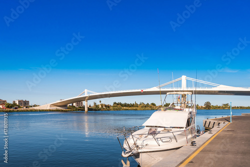 Sant Jaume d'Enveja new bridge 'Lo Passador' over Ebro river Ebro Delta, Tarragona, Catalonia, Spain. Copy space for text.