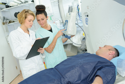 Nurses discussing patient's notes