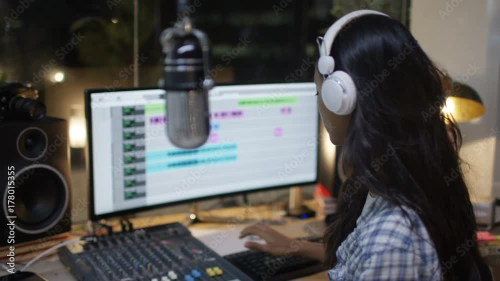 Singer recording & mixing a track in home recording studio Singer recording & mixing a track in home recording studio
