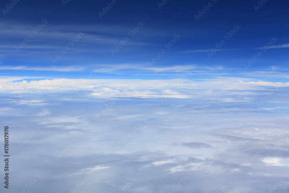 Puffy clouds seen from an airplane.