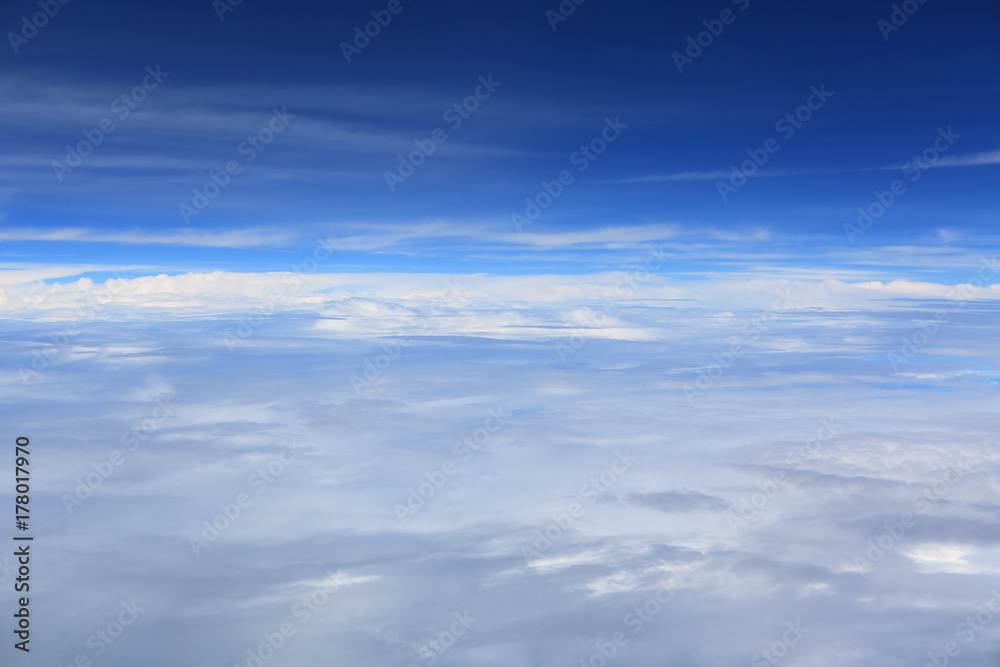 Puffy clouds seen from an airplane. Puffy clouds seen from an airplane.