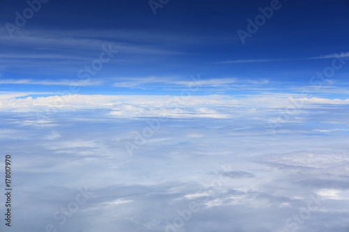 Puffy clouds seen from an airplane.