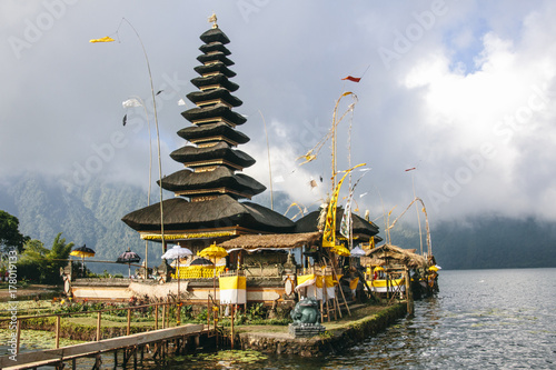 Asian temple and flags on a lake in Bali, Indonesia