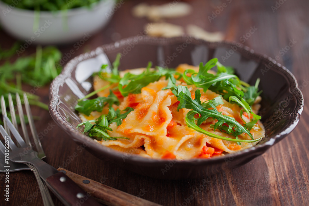 Pasta with tomato sauce and rocket salad Pasta with tomato sauce and rocket salad