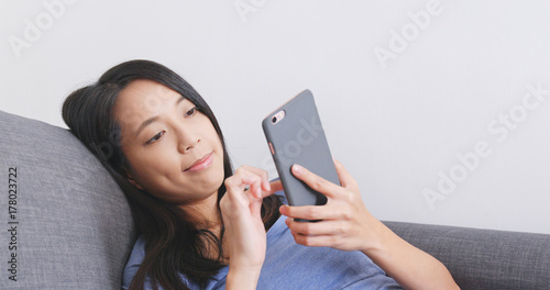 Woman use of cellphone at home